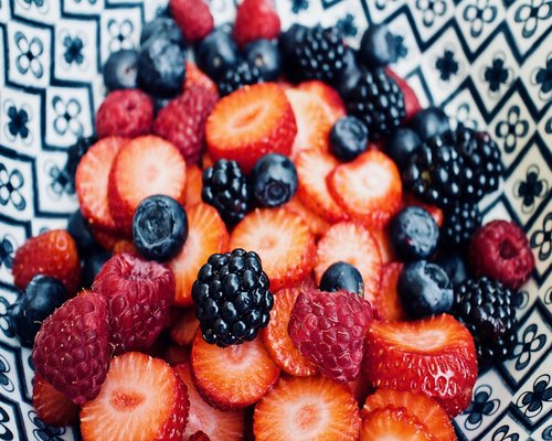 Bowl of fresh blueberries and strawberries